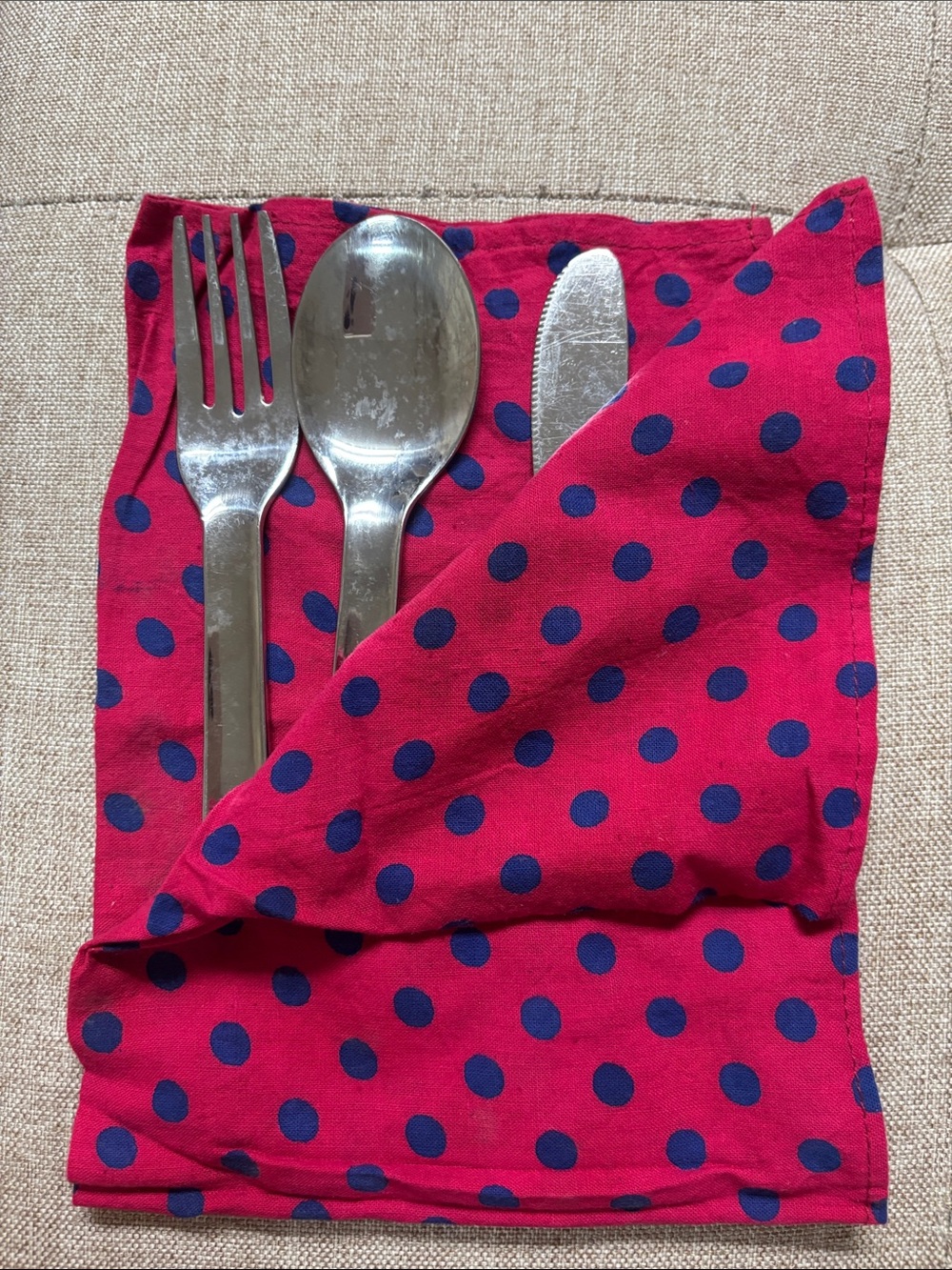 Stainless steel set(fork, spoon, knife) and napkin.